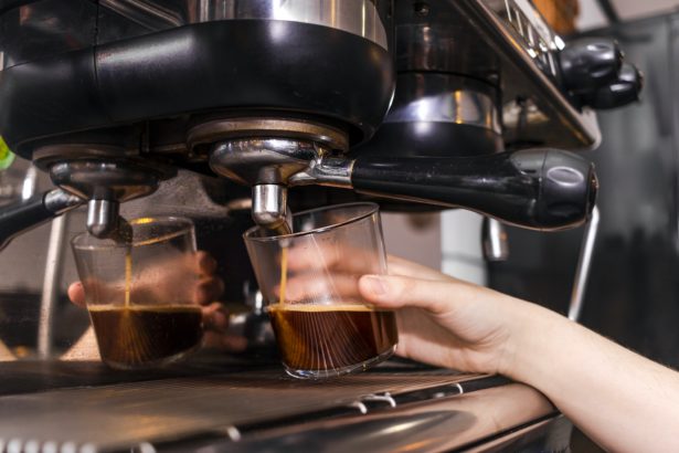Close up of fresh coffee in the coffee machine